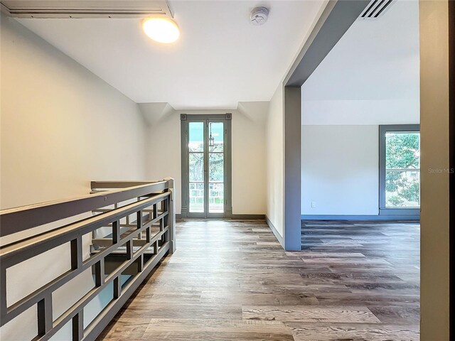 hallway with wood-type flooring