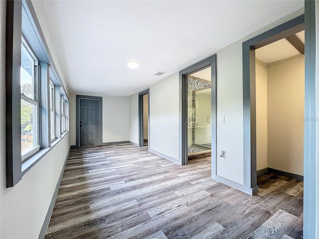 unfurnished room featuring hardwood / wood-style flooring