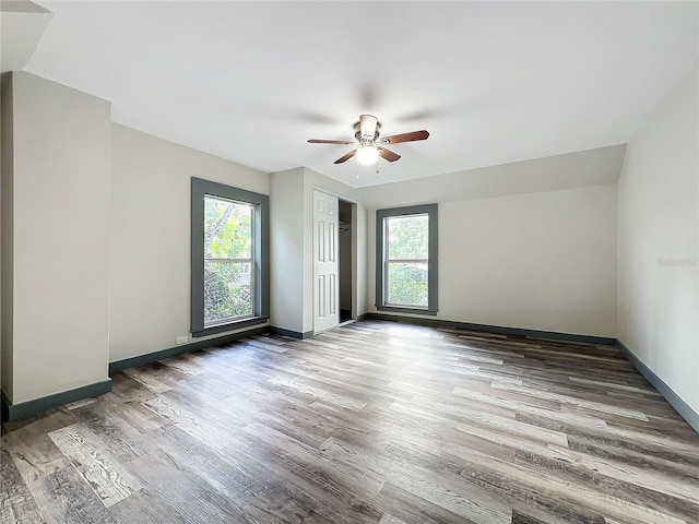 unfurnished room with wood-type flooring and ceiling fan