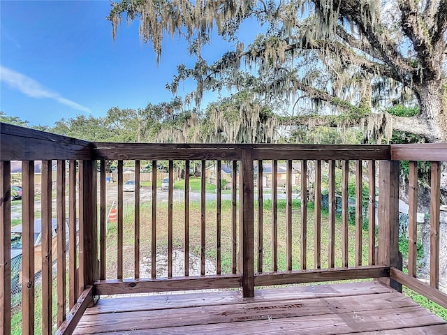 wooden deck with a yard