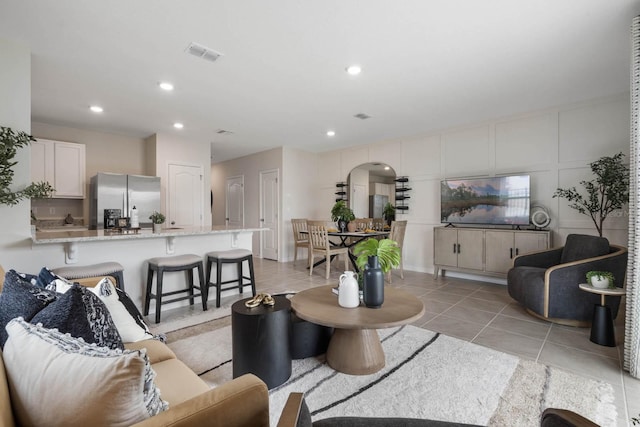 living room with light tile patterned floors