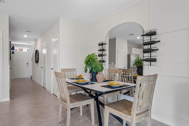 dining area featuring light tile patterned flooring