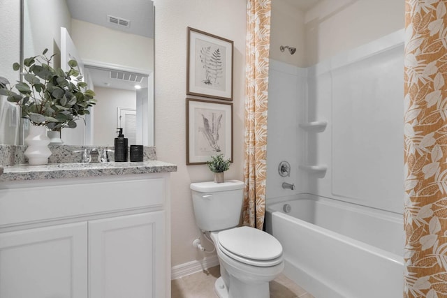 full bathroom with tile patterned flooring, shower / bath combo with shower curtain, toilet, and vanity