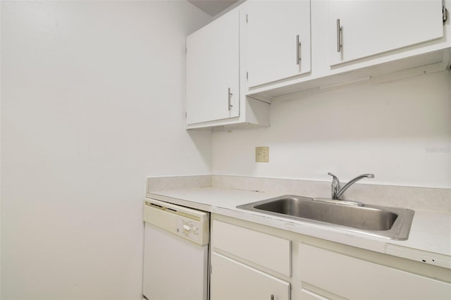 kitchen with sink, dishwasher, and white cabinetry