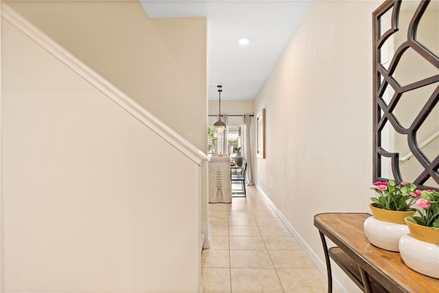 hallway featuring light tile patterned floors