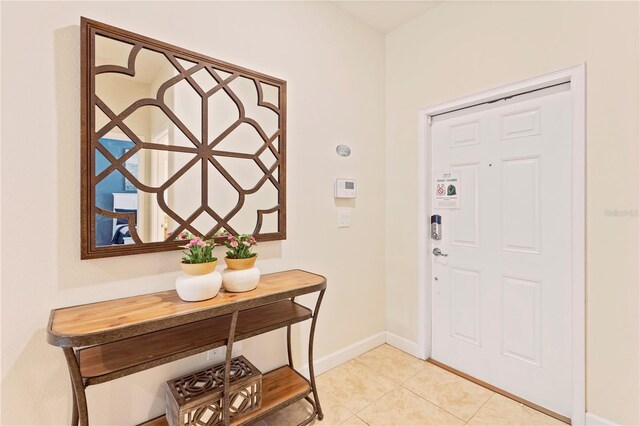 entryway featuring light tile patterned floors