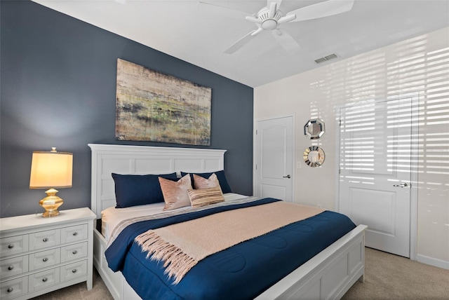 carpeted bedroom featuring ceiling fan