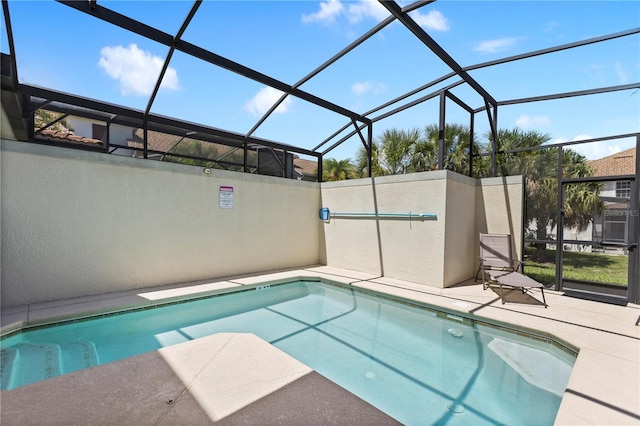 view of pool featuring a lanai and a patio area