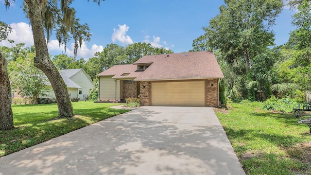 view of front of house featuring a garage and a front yard