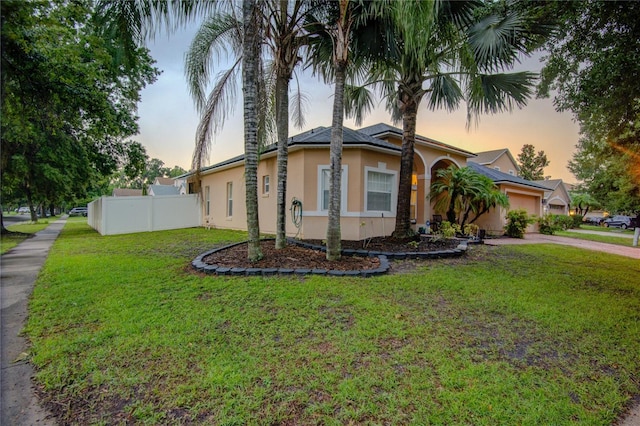 view of front of house with a lawn