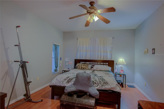 bedroom featuring light wood-type flooring and ceiling fan