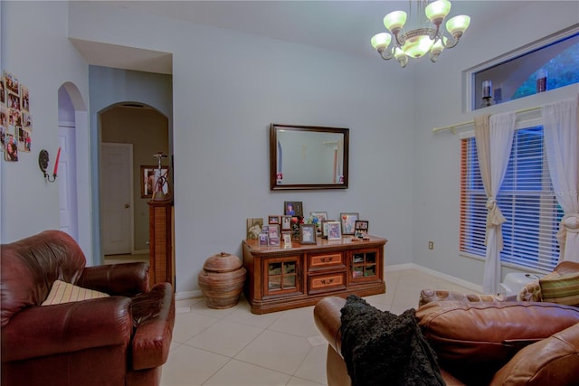 tiled living room featuring a chandelier