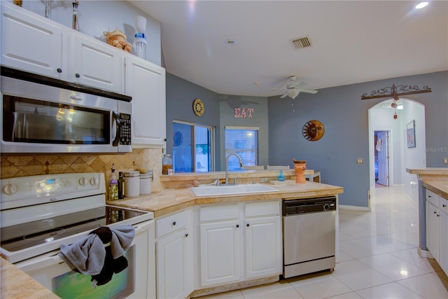 kitchen featuring white cabinetry and appliances with stainless steel finishes