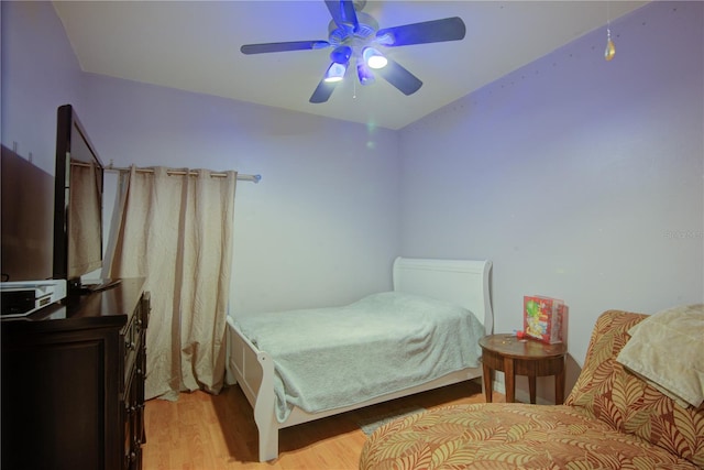 bedroom with light wood-type flooring and ceiling fan