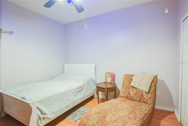 bedroom with ceiling fan and wood-type flooring