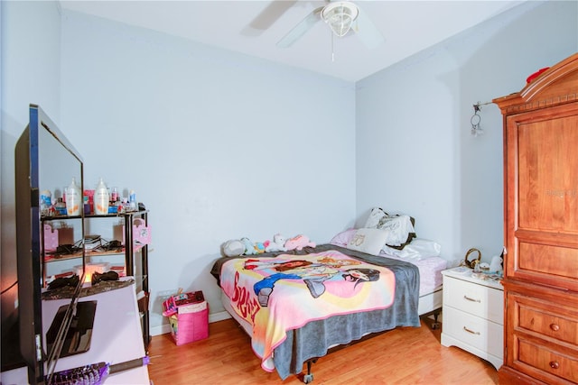 bedroom with light hardwood / wood-style flooring and ceiling fan