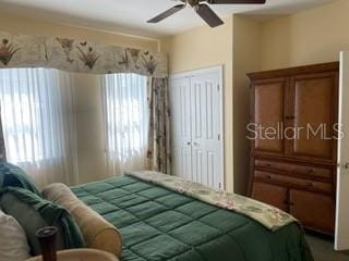 bedroom with a closet and a ceiling fan