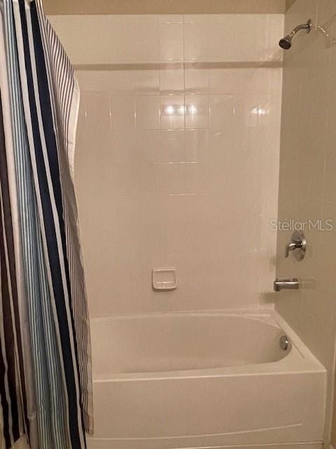 bathroom with shower / tub combo