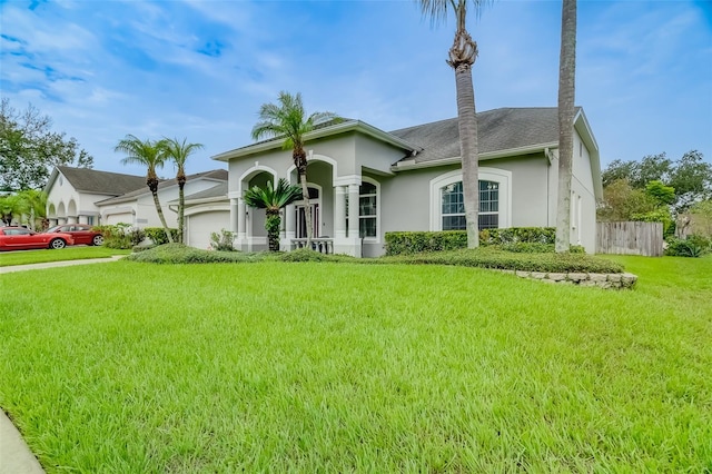 view of front facade with a garage and a front yard