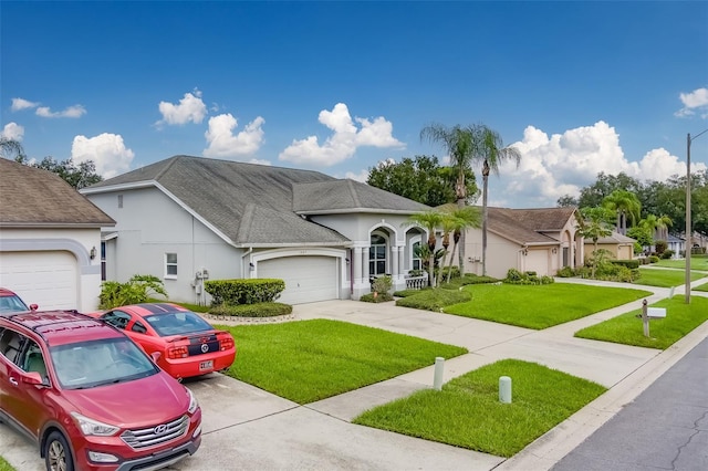 view of front facade featuring a garage and a front lawn