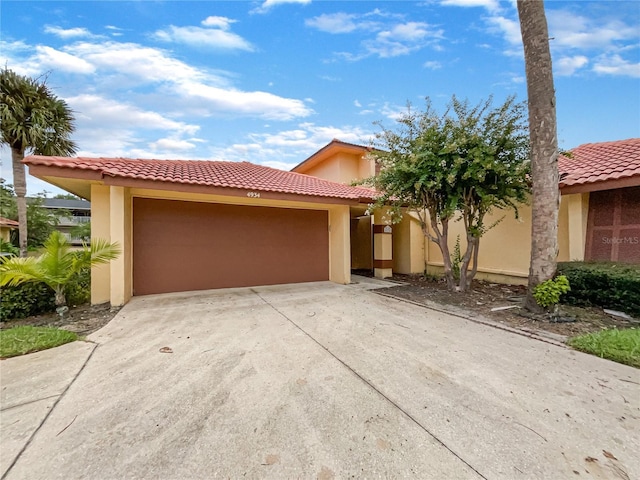 4934 Samoa Cir Unit 7, Orlando, FL 32808 - view of front facade featuring a garage