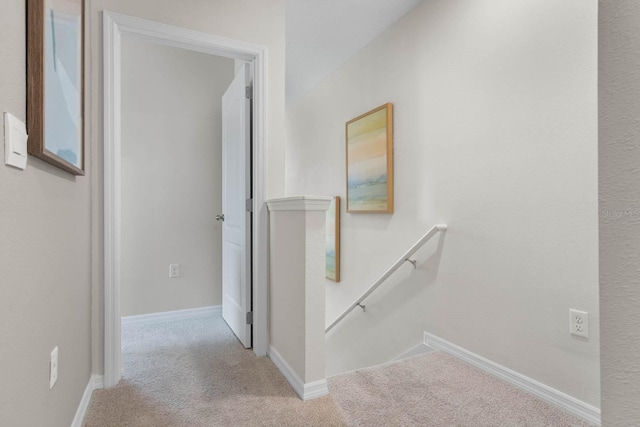 hallway featuring carpet flooring