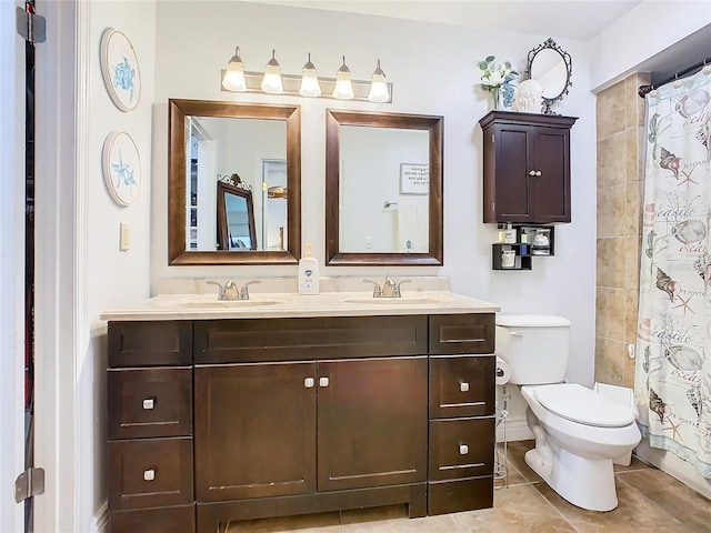 bathroom featuring tile patterned floors, vanity, a shower with shower curtain, and toilet