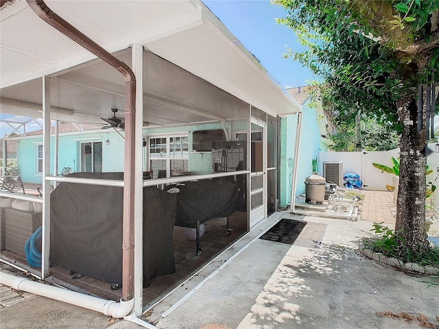 view of patio with ceiling fan and central air condition unit