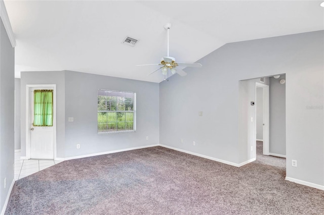 carpeted empty room with lofted ceiling and ceiling fan