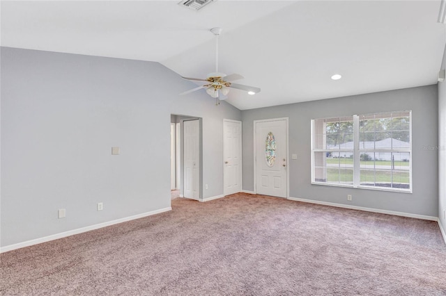 unfurnished room featuring carpet, ceiling fan, and vaulted ceiling