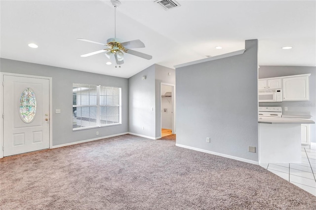 unfurnished living room featuring lofted ceiling, light colored carpet, and ceiling fan