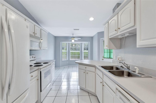 kitchen featuring sink, white cabinets, light tile patterned floors, ceiling fan, and white appliances