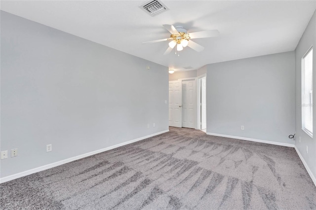 unfurnished room with carpet floors and ceiling fan