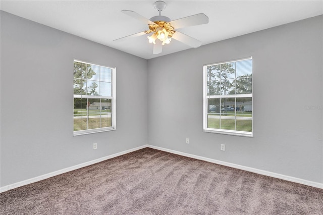 empty room featuring carpet and ceiling fan