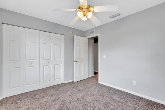 unfurnished bedroom with carpet, ceiling fan, and a closet