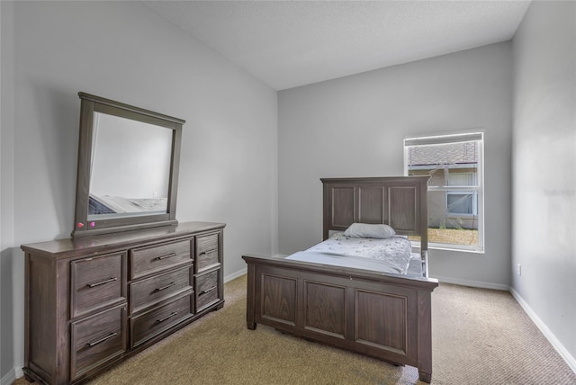 bedroom featuring light colored carpet