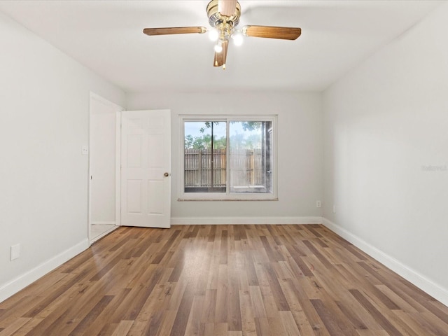 unfurnished room featuring hardwood / wood-style flooring and ceiling fan