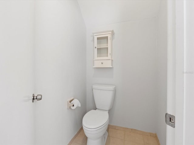 bathroom featuring tile patterned floors and toilet