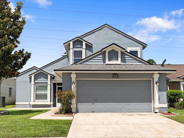 view of front facade featuring a garage, central AC, and a front lawn