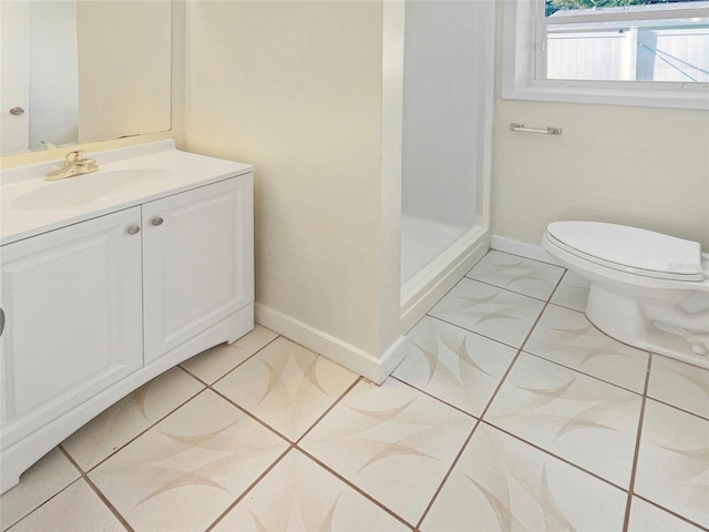 bathroom with vanity, toilet, a shower, and tile patterned floors