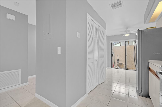 hallway with light tile patterned flooring