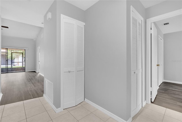 hallway with light tile patterned floors