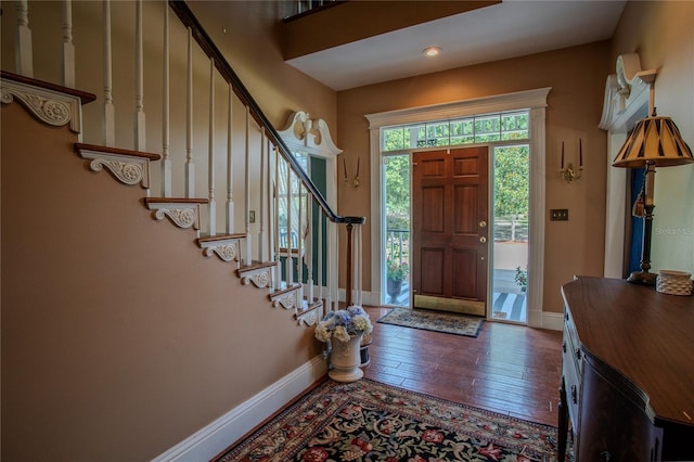 foyer with dark wood-type flooring