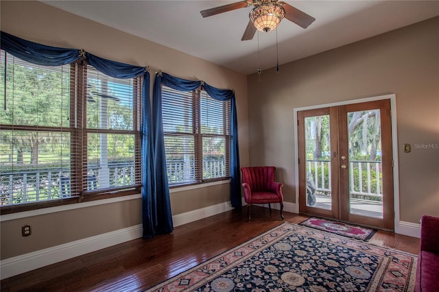 interior space featuring wood-type flooring, ceiling fan, and french doors