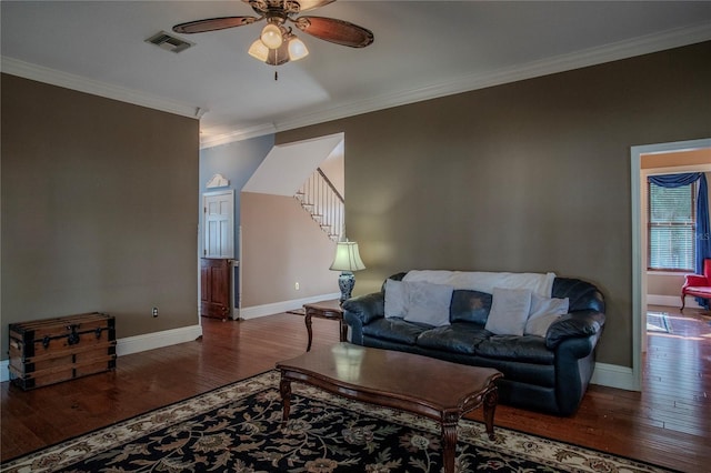 living room with ceiling fan, hardwood / wood-style floors, and ornamental molding