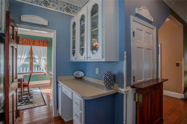 kitchen featuring white cabinetry and dark hardwood / wood-style flooring