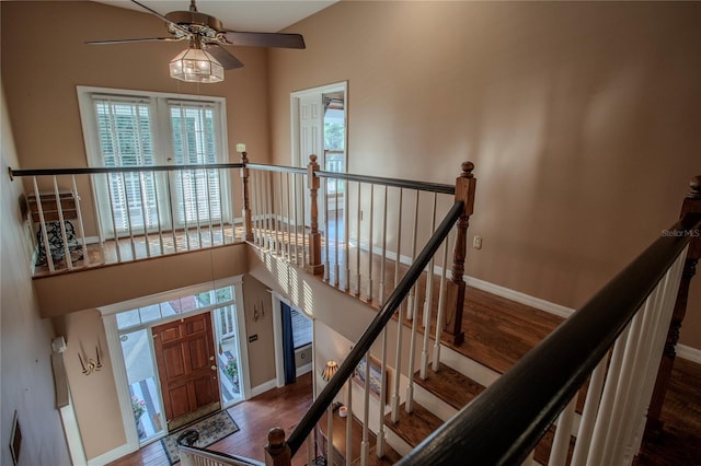 foyer entrance with hardwood / wood-style flooring and a high ceiling