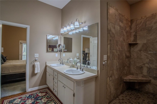 bathroom featuring vanity and a tile shower