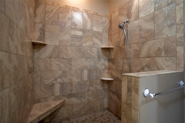 bathroom featuring tiled shower