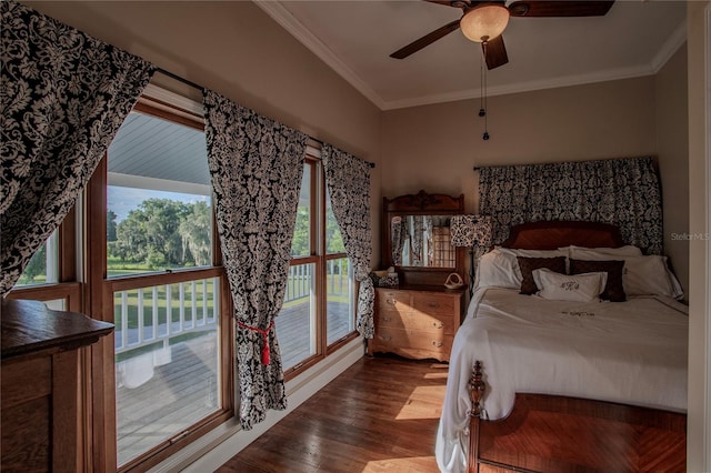 bedroom with wood-type flooring, crown molding, and ceiling fan